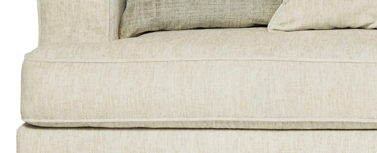 Close-up of Ashley Rawcliffe cream seat cushion upholstery and piping.
