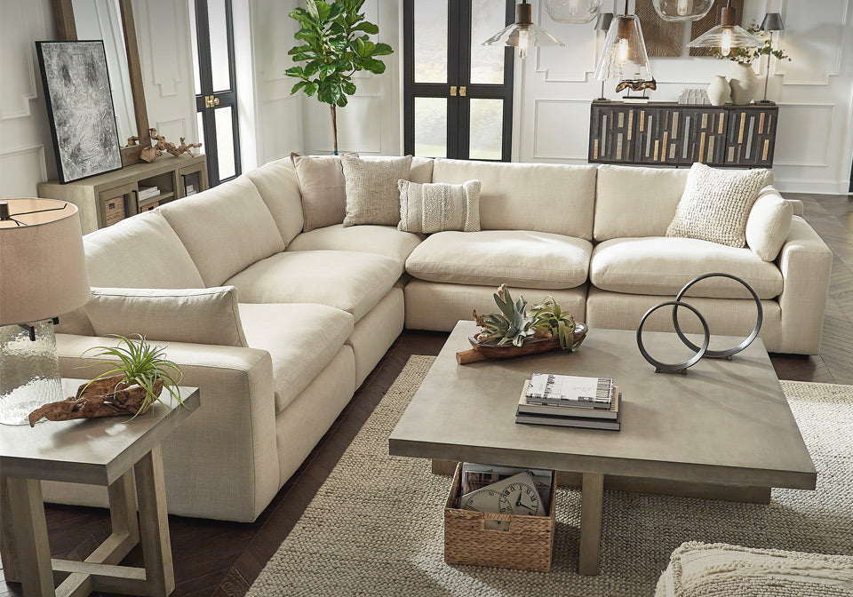 Elyza Beige Cloud Sectional behind living room table